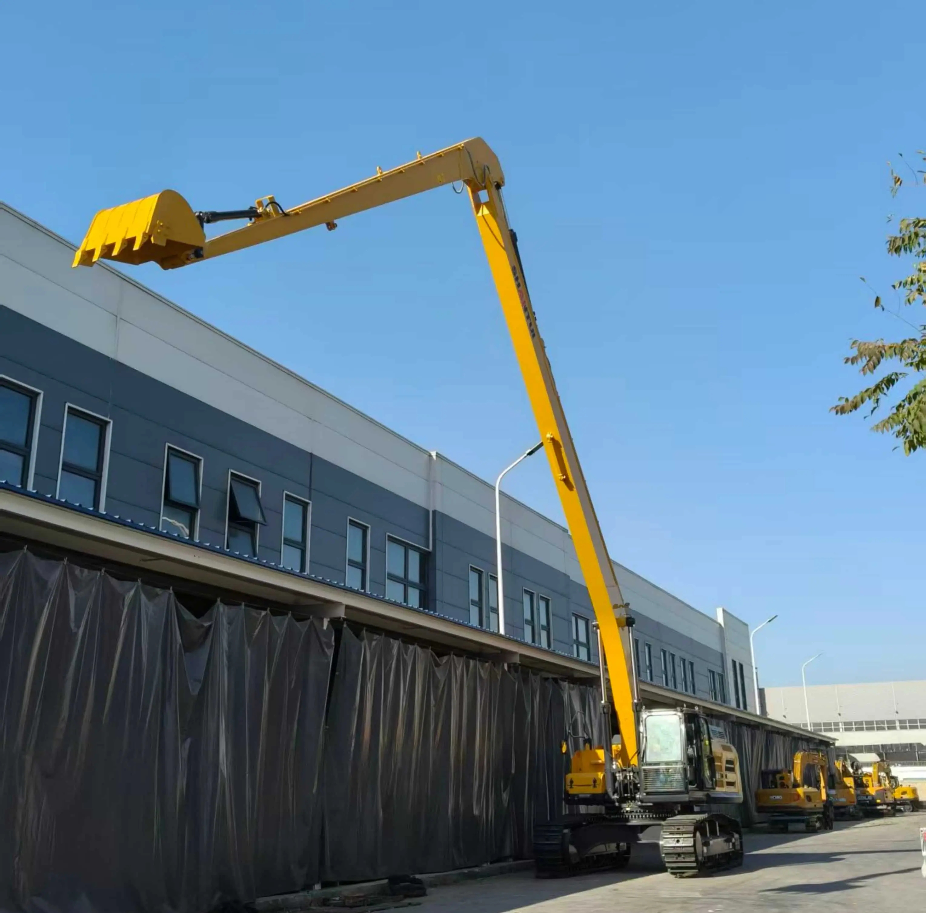 Long reach arm and boom