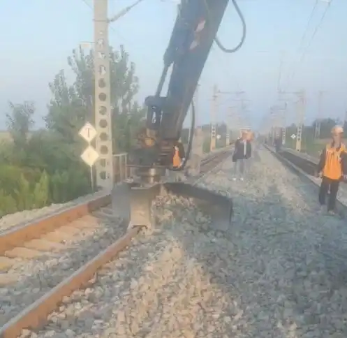 What is a railway excavator ballast plow?