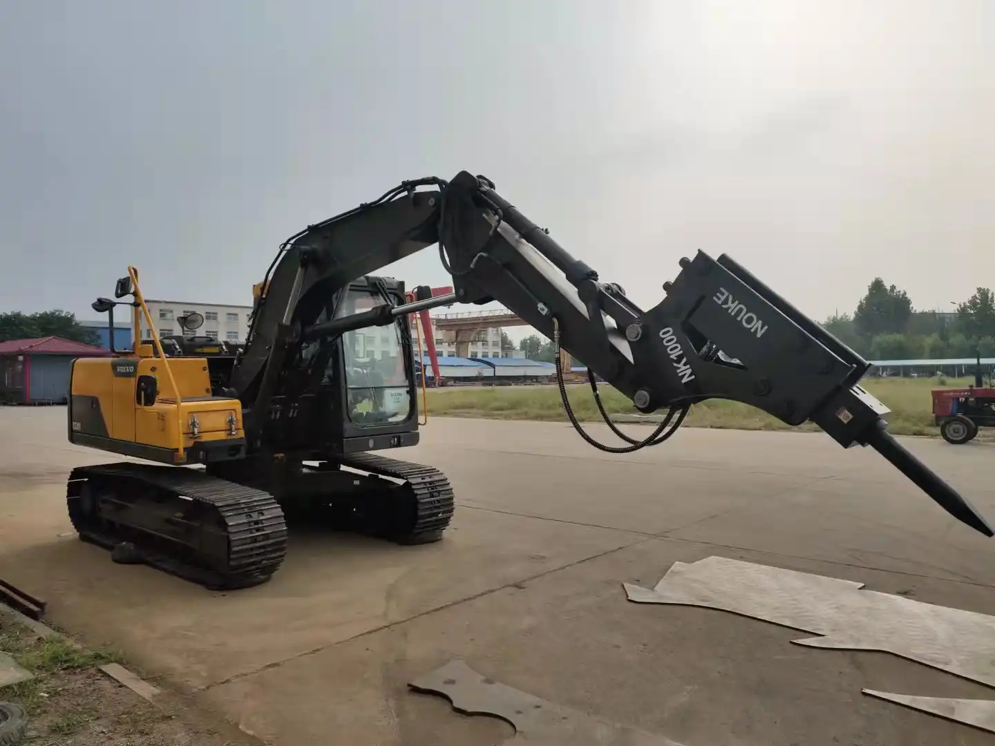 Wat is 'n tonnelarm op 'n graafmachine?