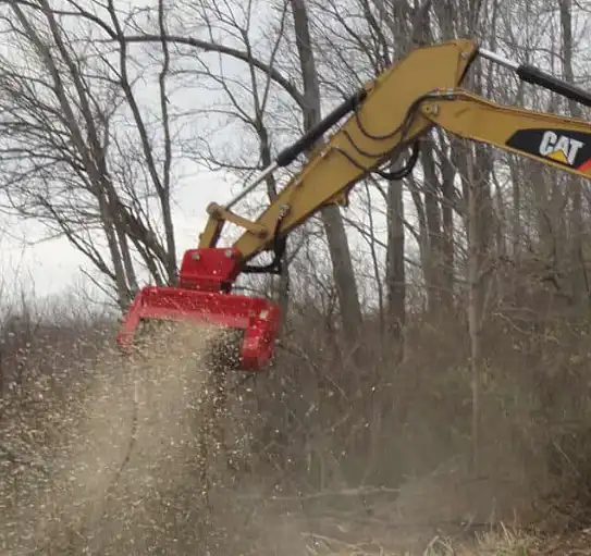 What is the difference between a mulcher and a brush cutter?