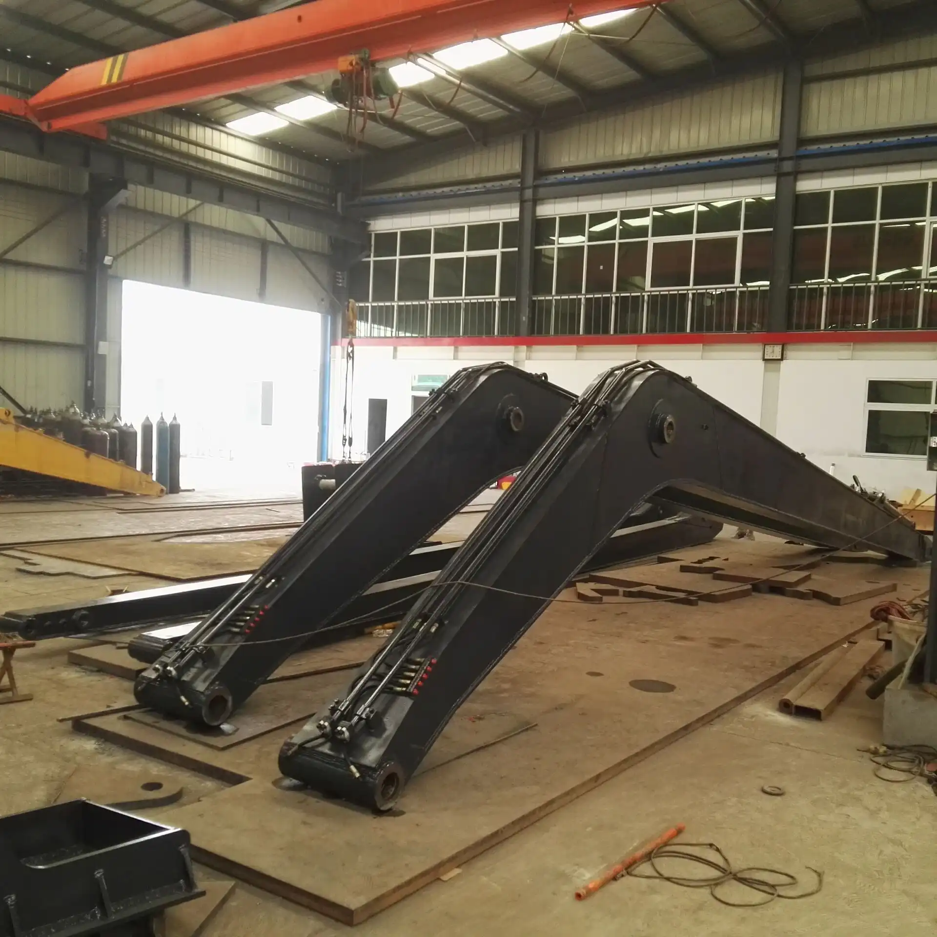 What is a mono boom on an excavator?