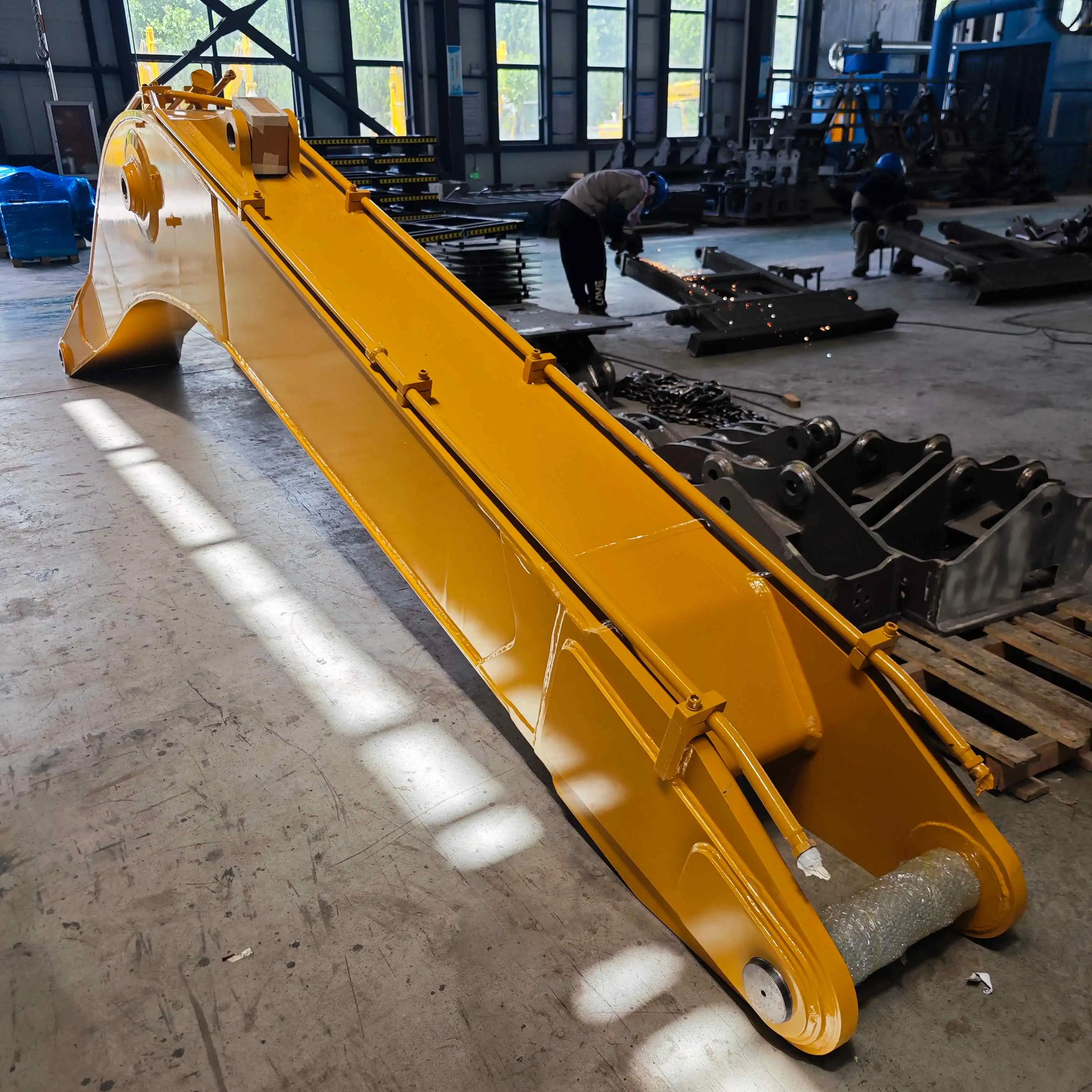 What are excavator booms made of?
