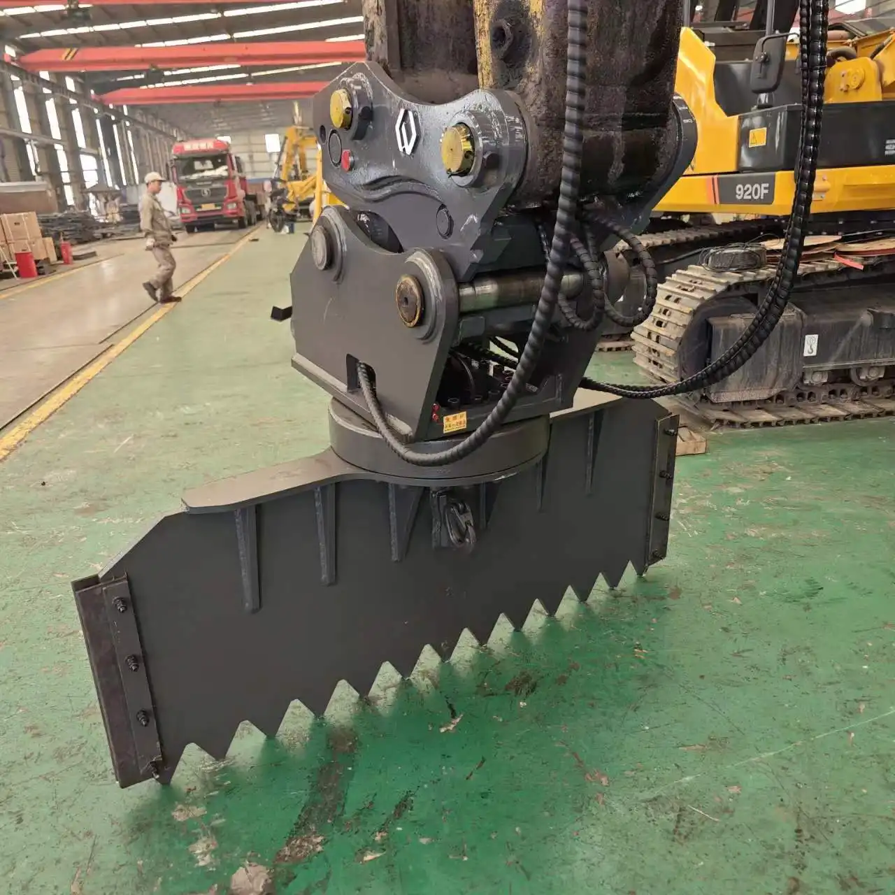 What are the benefits of the elevated cab height in an excavator rotating scraper?
